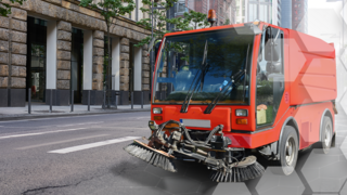 HYDAC Lösungen für Kommunalmaschinen in urbanen Gebieten: Rotes Multicar auf Straße
